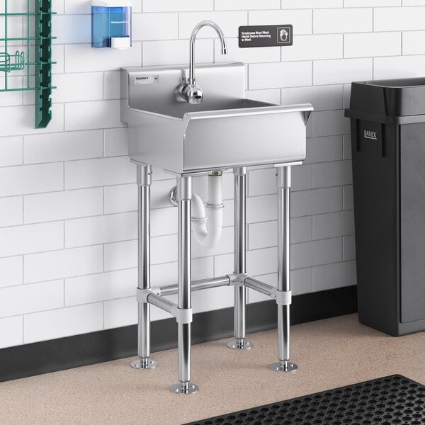 A Regency stainless steel hand sink with a Waterloo wall mount hands-free sensor faucet.