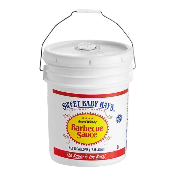 A white bucket with a handle filled with Sweet Baby Ray's Original BBQ Sauce.