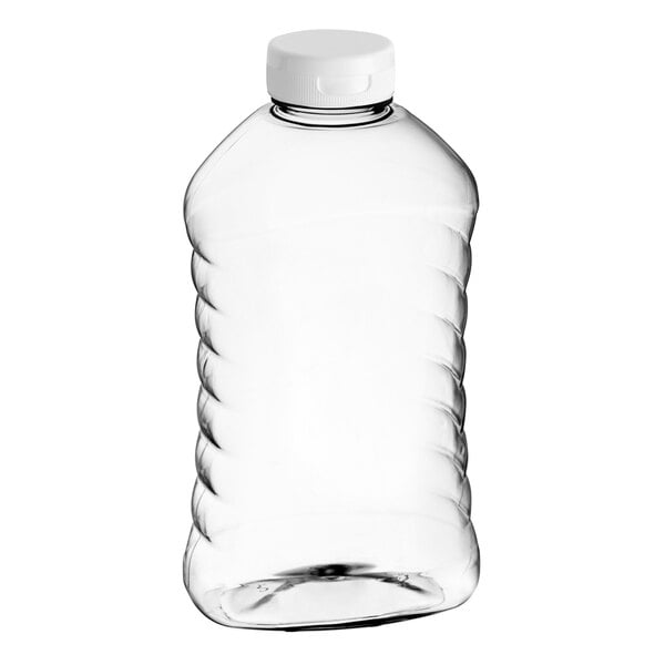 A clear plastic ribbed hourglass honey bottle with a white flip top lid.