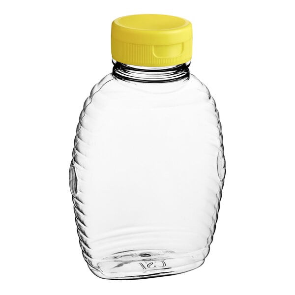 A clear plastic bottle with a yellow lid.