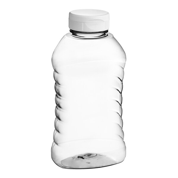 A clear ribbed PET honey bottle with a white cap.