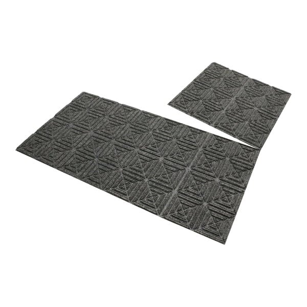 Two grey rectangular WaterHog mat tiles with geometric designs.