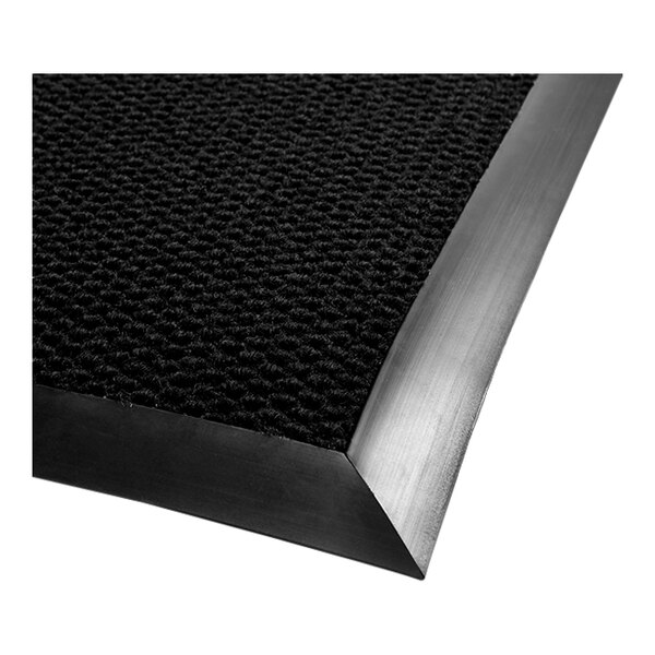 A black Berber carpet mat with a rubber border.