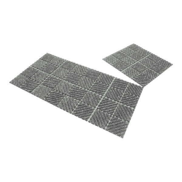 Two grey WaterHog Max mat tiles with black squares on them.