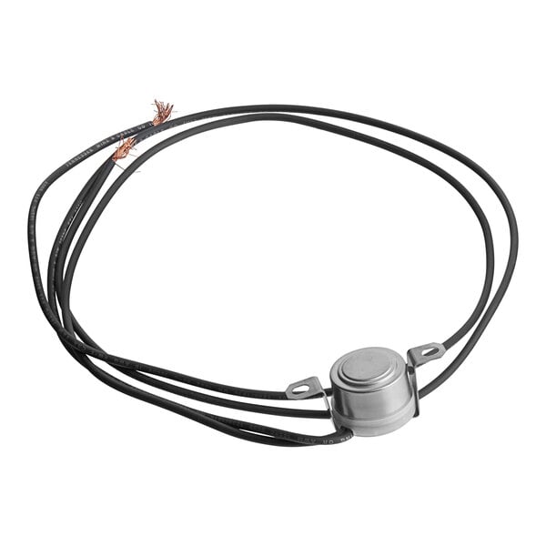 A black and white cord with a round silver button and a black wire connected to a round metal object.