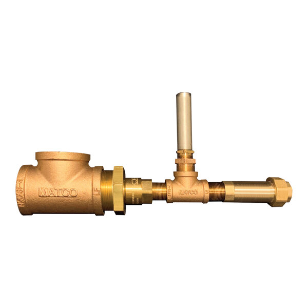 A close-up of a brass Cleveland drain tempering valve.