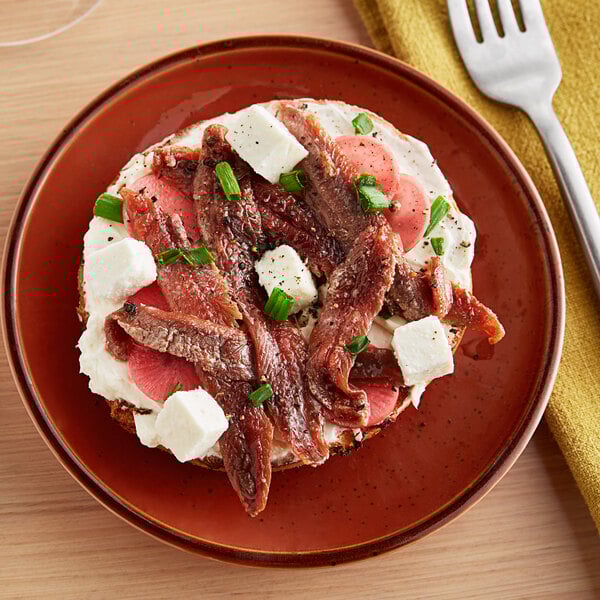 A plate with Sea Tales anchovy fillets on it.