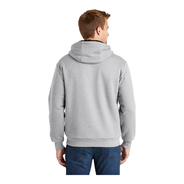 A person wearing a CornerStone athletic heather grey full-zip hoodie with thermal lining.
