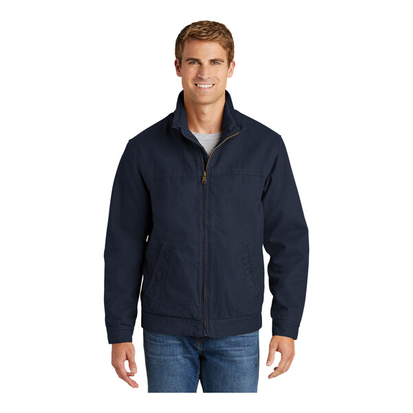 A man wearing a CornerStone navy work jacket.