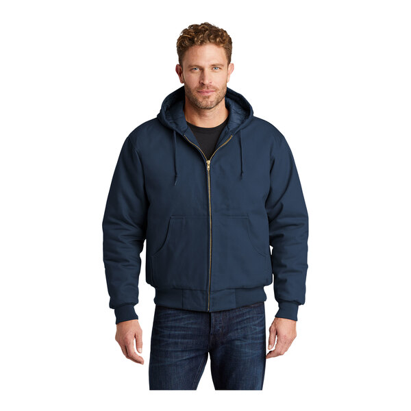 A man wearing a CornerStone navy duck cloth hooded work jacket.