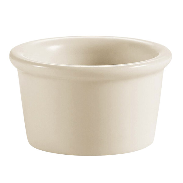 A CAC ivory china ramekin with a round rim on a white background.