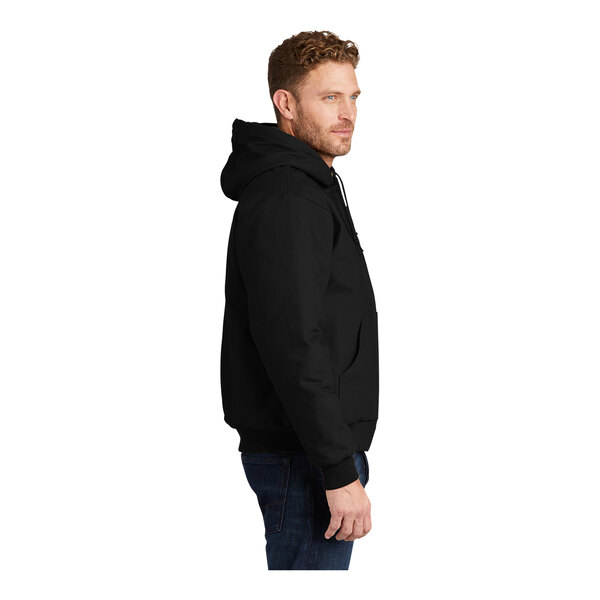 A person wearing a black CornerStone hooded work jacket.