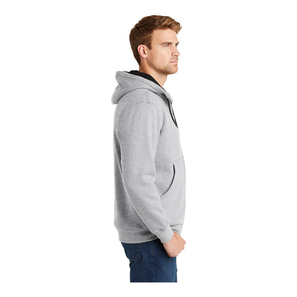A man wearing a CornerStone athletic heather full-zip hooded sweatshirt with thermal lining.