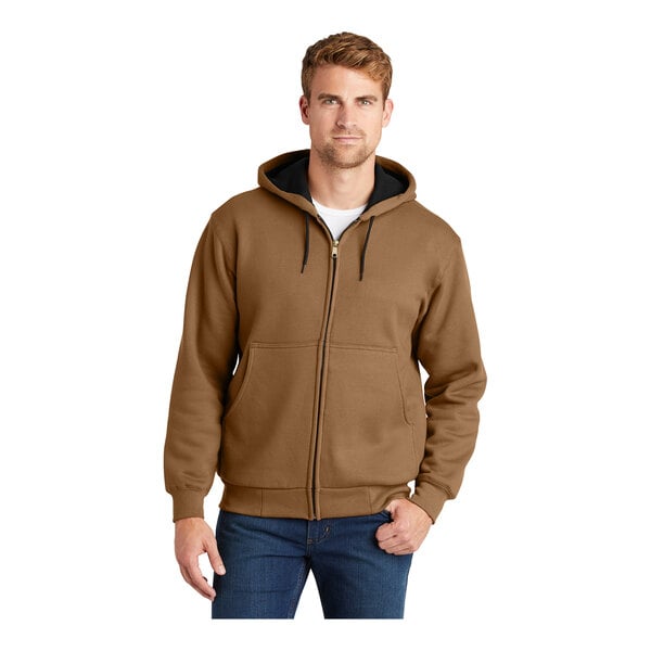 A man wearing a CornerStone duck brown full-zip hooded sweatshirt.