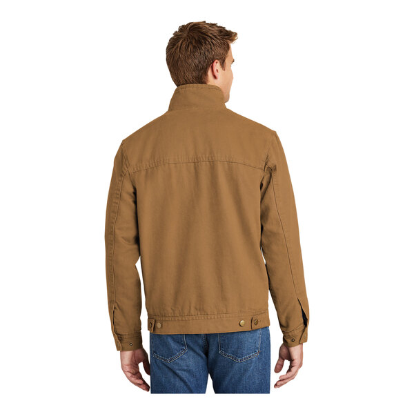 A man wearing a brown CornerStone work jacket.