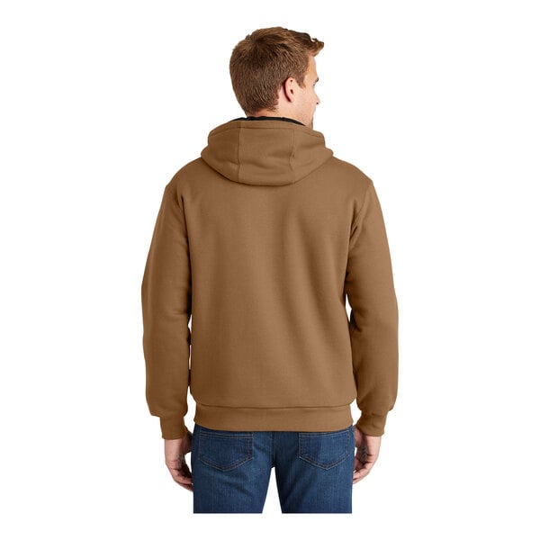 A man wearing a CornerStone brown sweatshirt with a thermal lining.