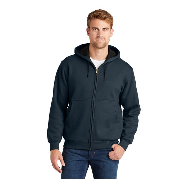 A man wearing a navy CornerStone zip-up hooded sweatshirt.