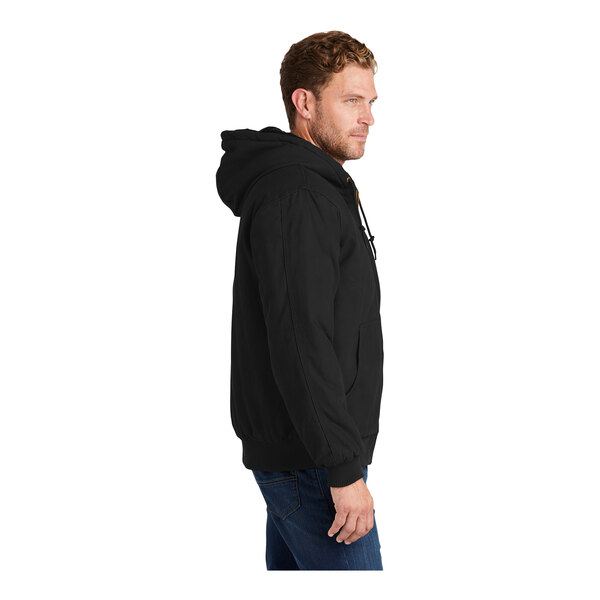 A man wearing a black CornerStone insulated hooded work jacket.