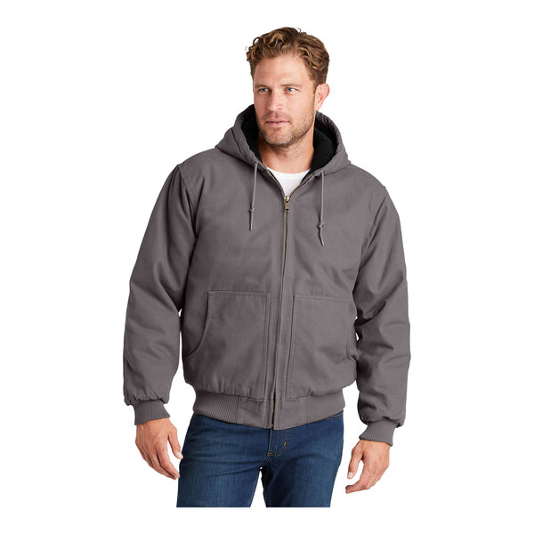 A man wearing a CornerStone metal gray hooded work jacket.