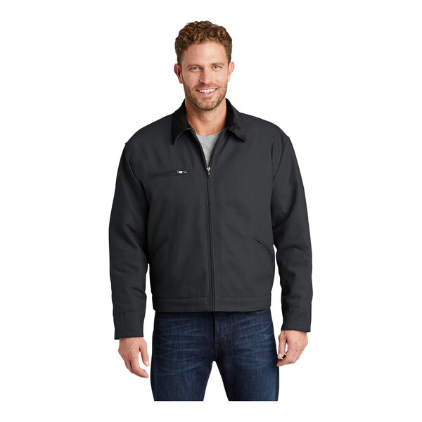 A man wearing a CornerStone charcoal work jacket with a black corduroy collar.