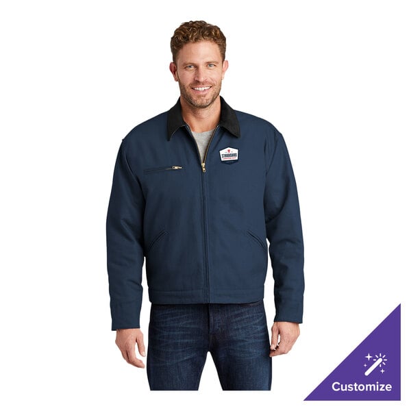 A navy unisex work jacket with a black corduroy collar, zippered chest pocket, and customizable logo on the chest.