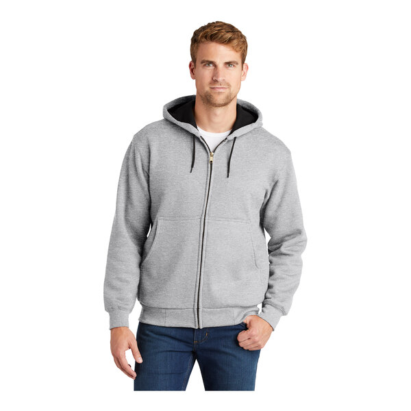 A man wearing a CornerStone heavy weight grey hooded jacket with black trim.