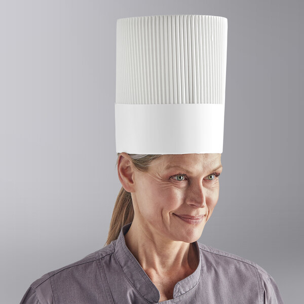 A woman wearing a white Choice disposable chef hat.
