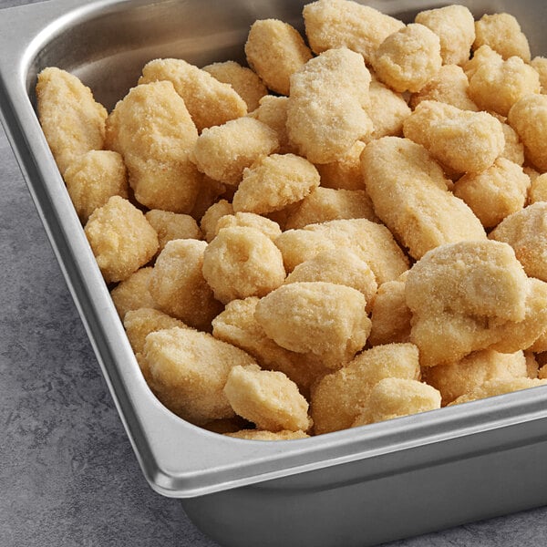 A close up of a tray of Ellsworth Cooperative Creamery Beer-Battered Cheddar Cheese Curds.