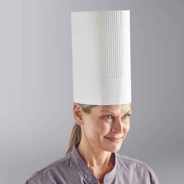 A woman wearing a Choice disposable chef hat on her head.