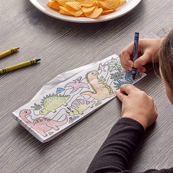 A child coloring a Choice Kids Dino Disposable Cap.