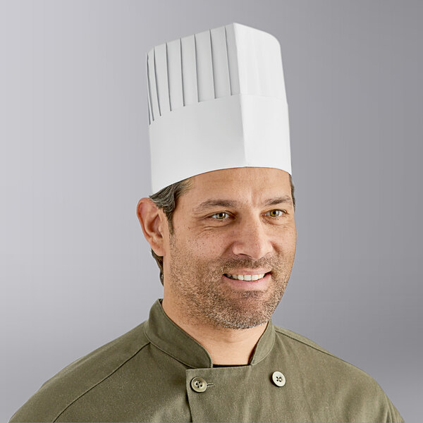 A man wearing a white Choice pleated chef hat.