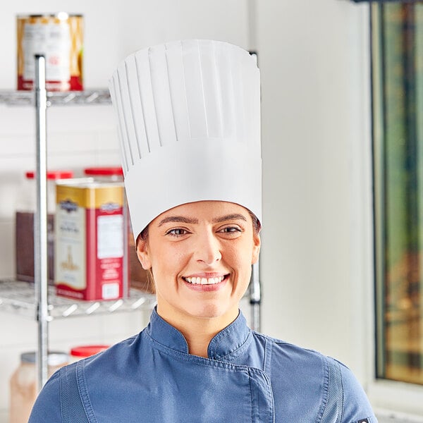 A woman wearing a white Choice pleated chef hat.