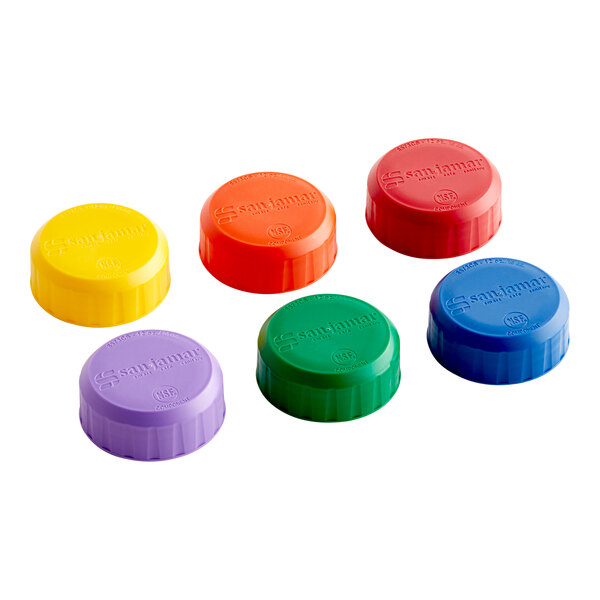 A set of six San Jamar colorful plastic caps for EZ-KLEEN slim sauce bottles in blue, green, orange, purple, red, and yellow.