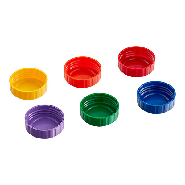 A group of colorful plastic caps including red, blue, green, yellow, and purple.