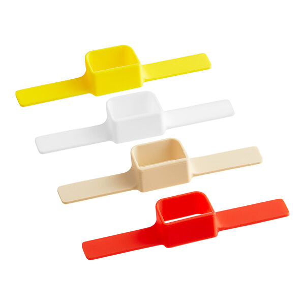 A group of colorful plastic clips including white, red, yellow, and blue.
