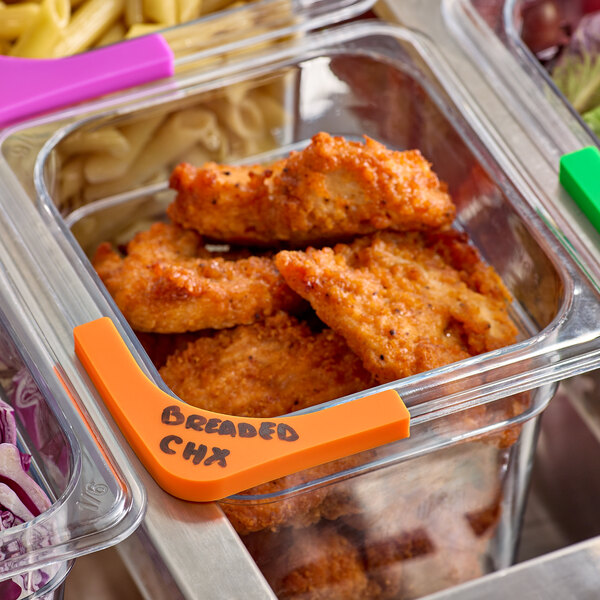 A container of food in a metal container with an orange Choice label.