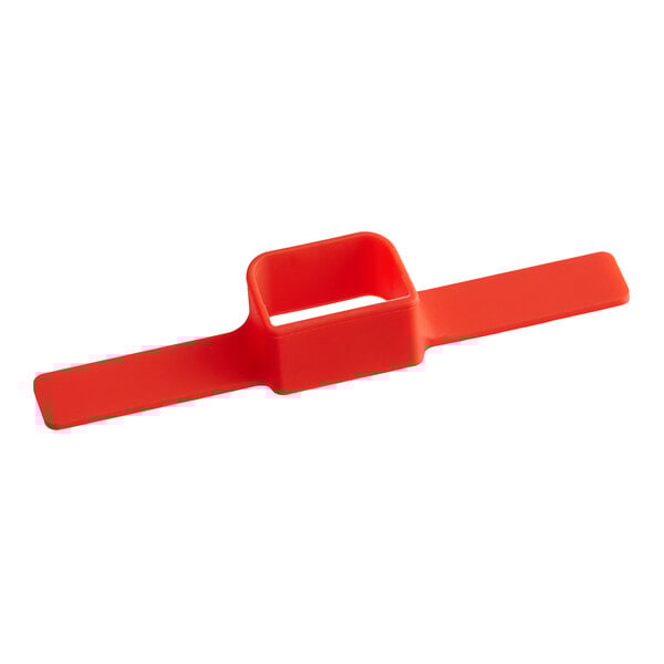 A red plastic clip with a square hole.