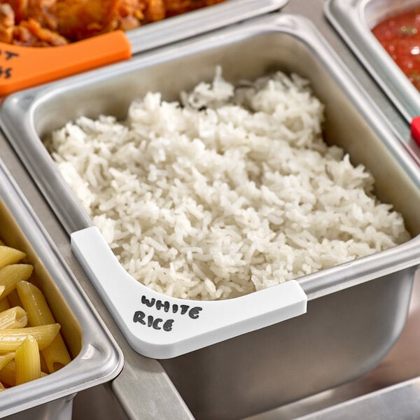 A metal container of white rice with a white Vigor corner label.