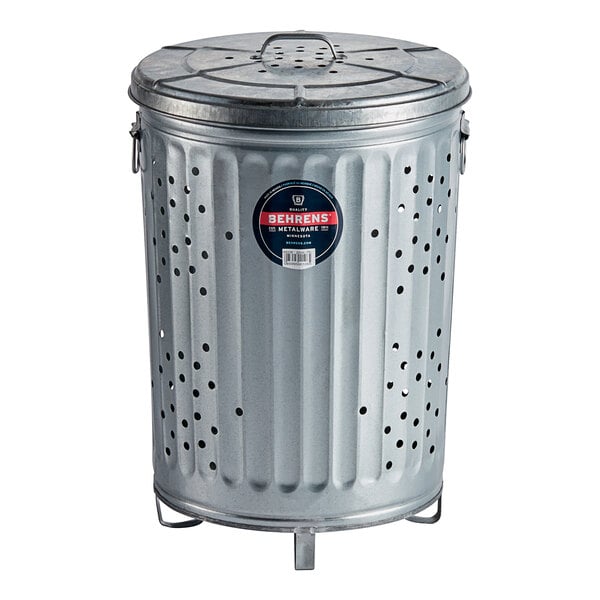A silver galvanized metal Behrens compost bin with holes and a lid.