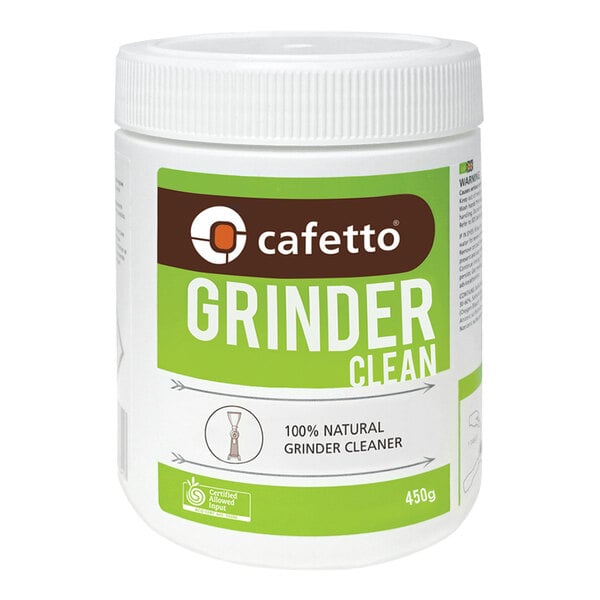 A white container of Cafetto Grinder Clean with a green label on a counter.