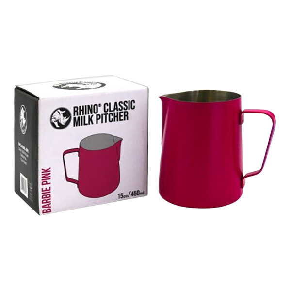 A Rhino Coffee Gear Barbie Pink milk pitcher next to its box.
