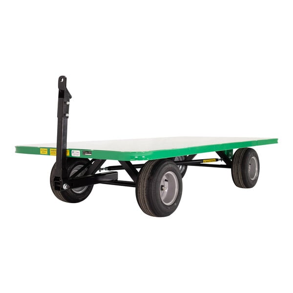 A green Valley Craft quad-steer trailer with black wheels.