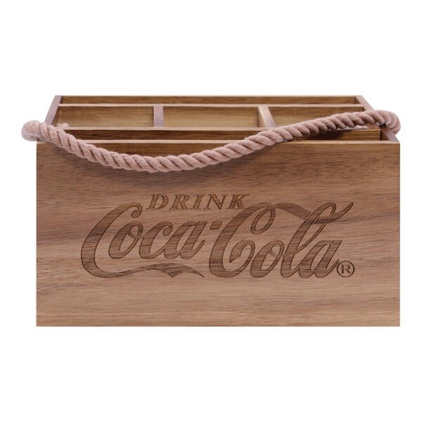 A Tablecraft Coca-Cola acacia wood flatware and condiment caddy with a rope handle.