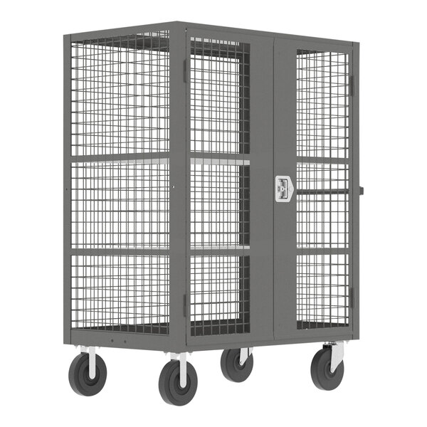 A grey Valley Craft security cart with shelves and a metal cage door on wheels.