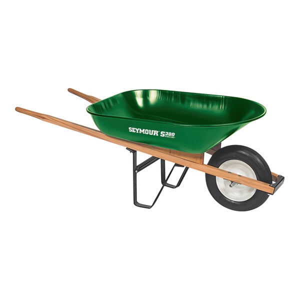 A green Seymour Midwest wheelbarrow with wooden handles.