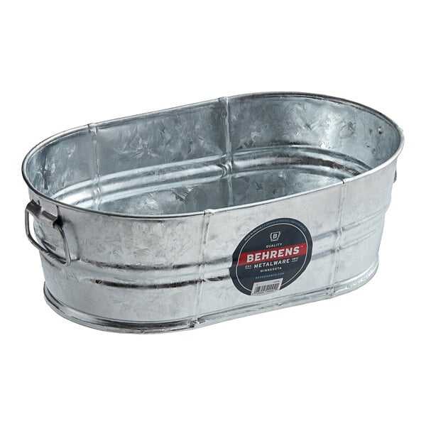 A Behrens hot-dipped steel oval tub with a handle.