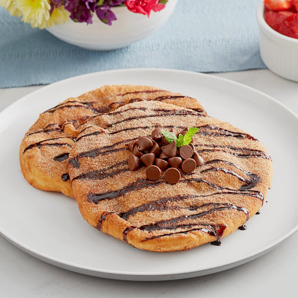 Brian's Fabulous FryBreads  on a plate with chocolate chips and strawberries.