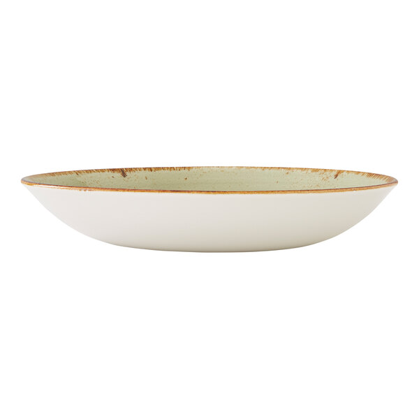 A shallow, round green coupe bowl with a rustic brown rim.