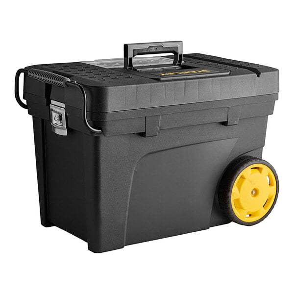A Stanley black mobile tool chest with yellow wheels.