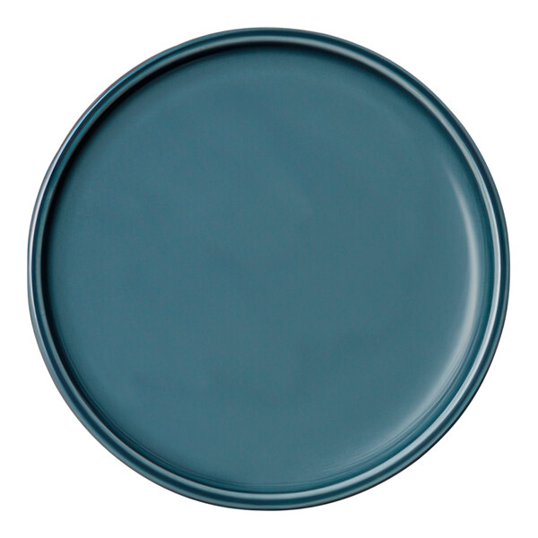 A close-up of a Schonwald Petrol Blue coupe plate with a rim.